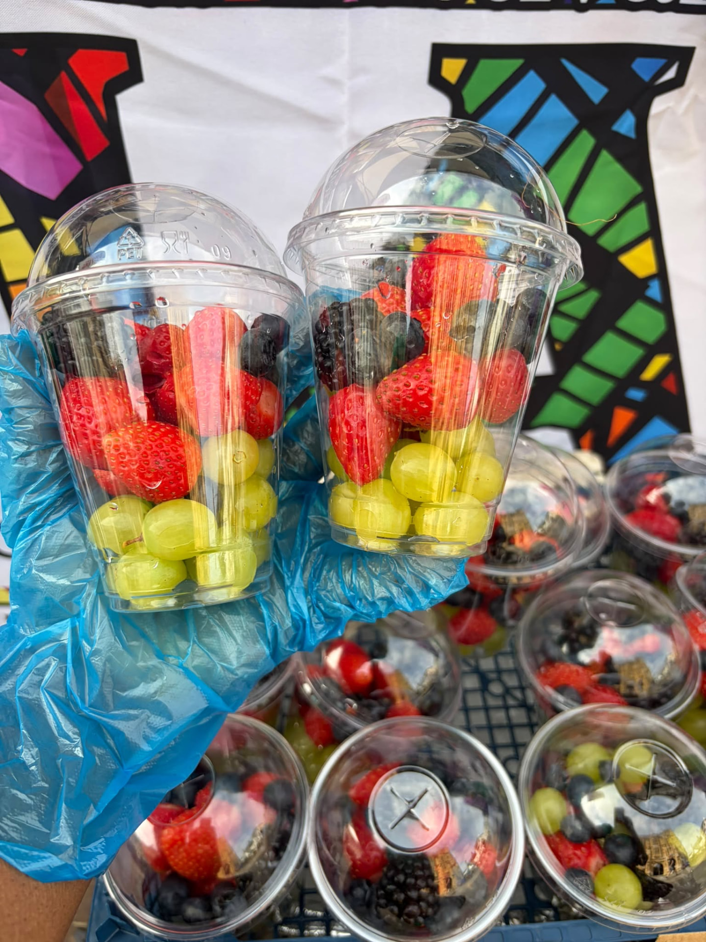 Fresh fruit cups with strawberries, grapes and blueberries for events