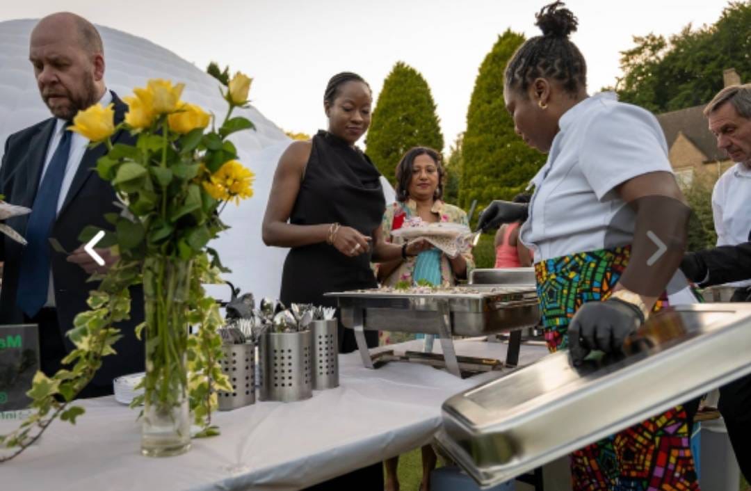 Ma's African Kitchen serving guests at an outdoor catered event